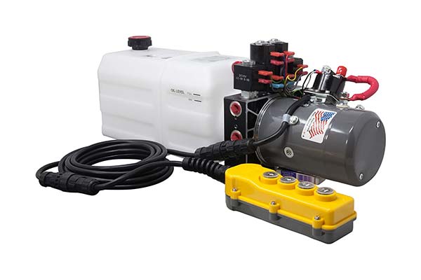 KTI dual double-acting hydraulic power unit with white reservoir, gray motor, attached cable, and yellow four-button controller.
