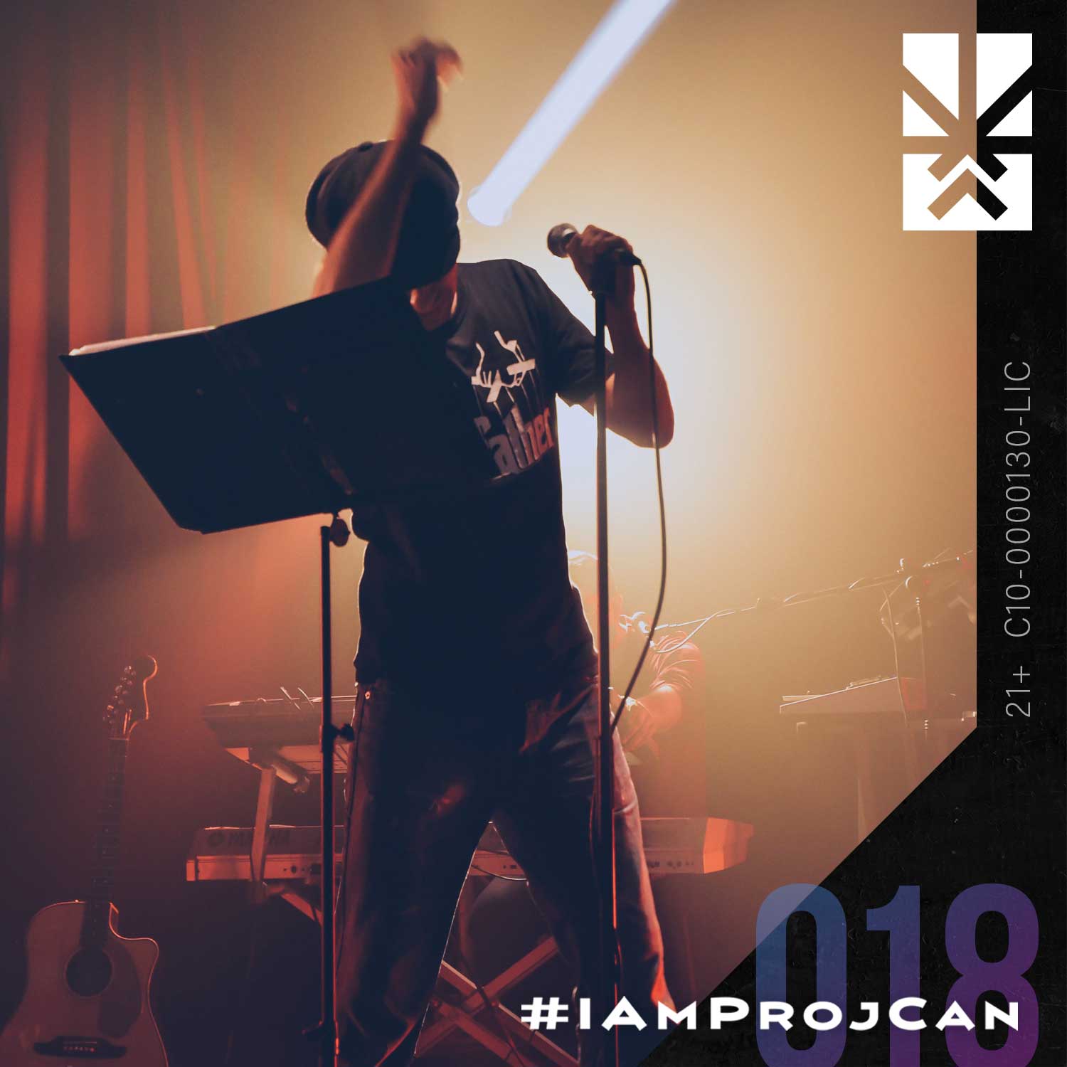 I’m ProjCan champion 018 performing onstage with a microphone under warm concert lighting.