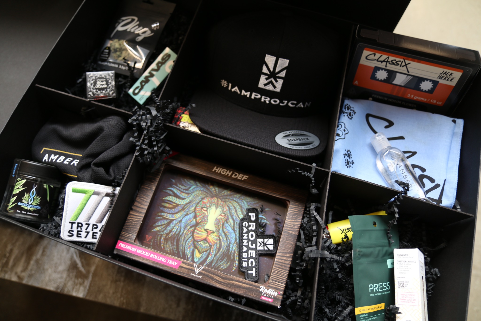 Open I’m ProjCan gift box containing branded cannabis products, apparel, accessories, a rolling tray, and campaign merchandise.