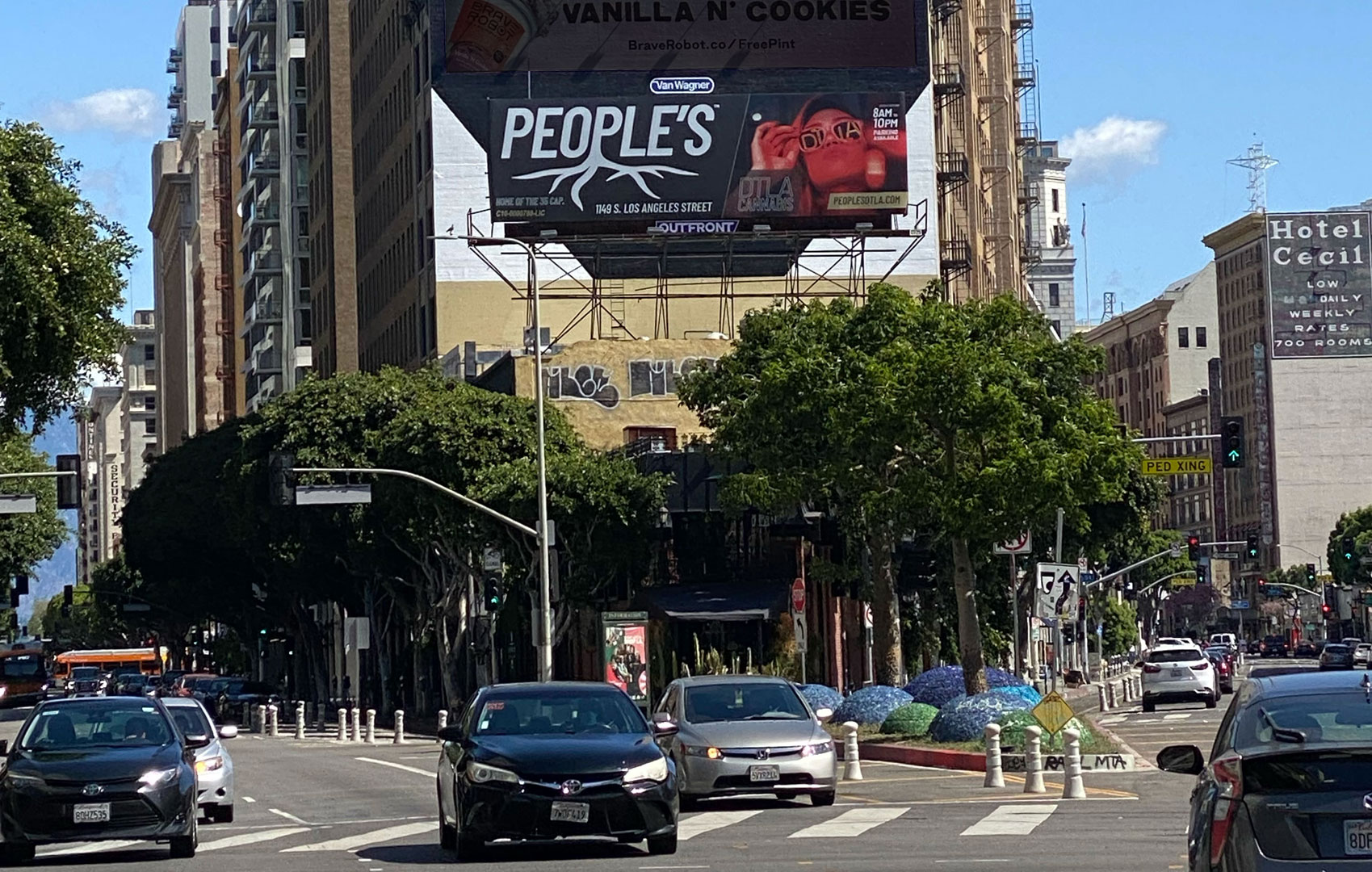 People’s DTLA billboard campaign installed above a busy downtown Los Angeles intersection.