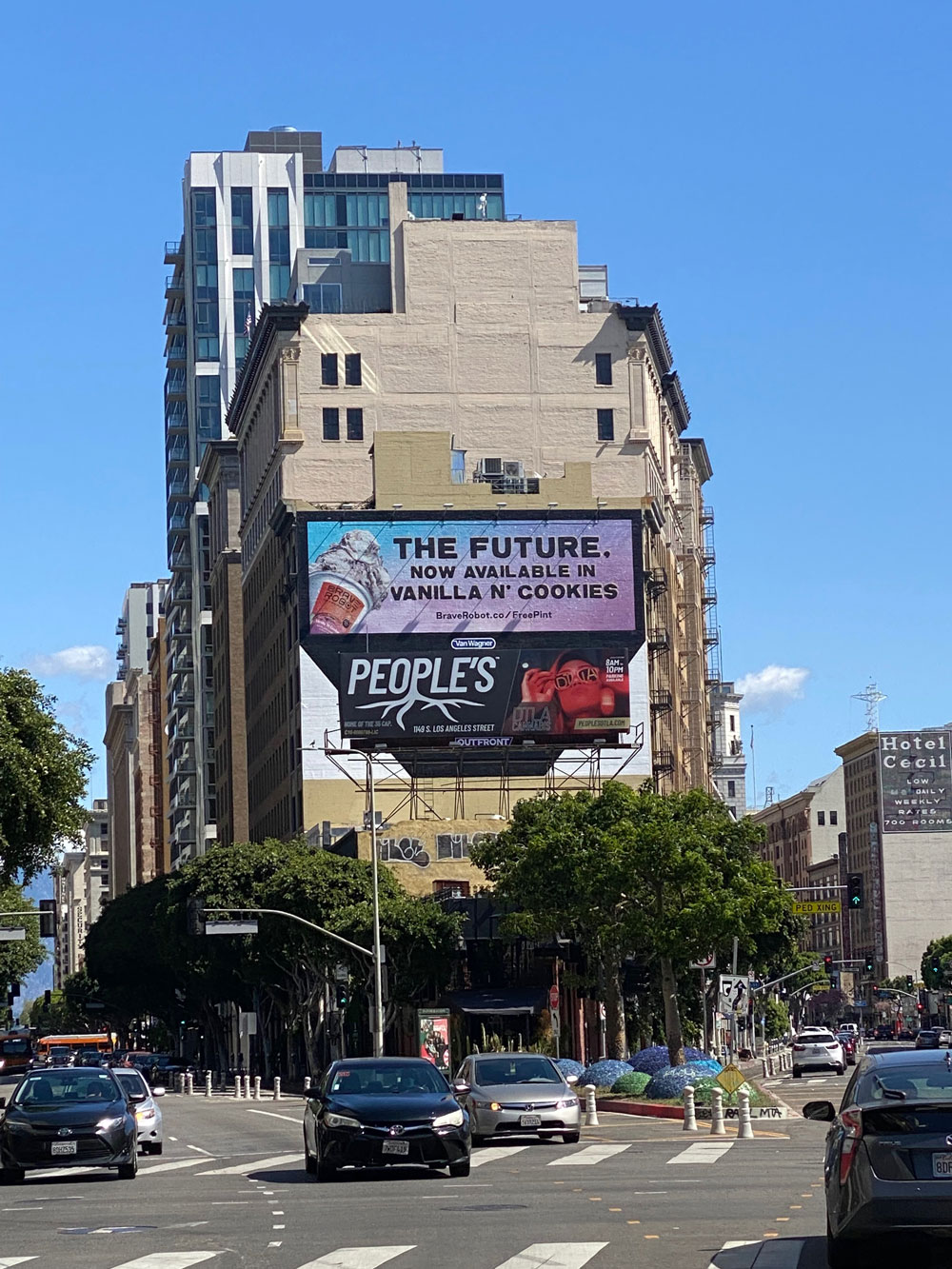 People’s billboard installed on a downtown Los Angeles building above a busy street.